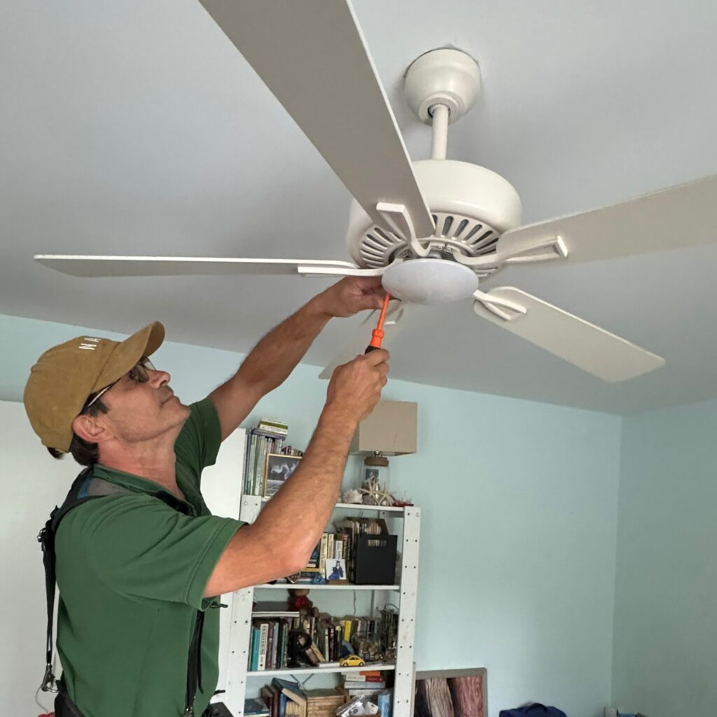 Tim Furgione, Owner-Operator of TLEEF Electric fixing a paddle fan for an Olney MD homeowner.